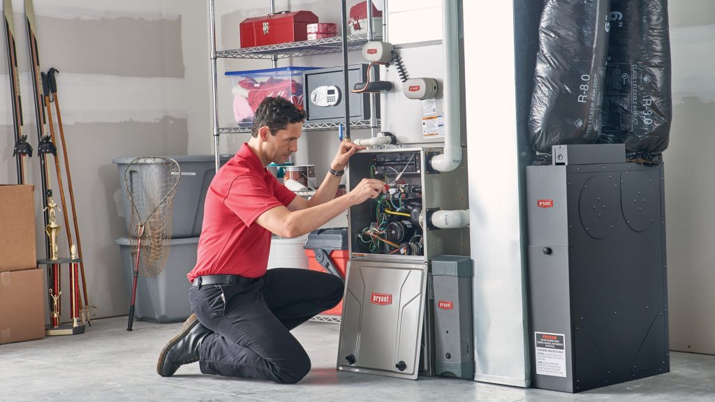 HVAC contractor working on furnace