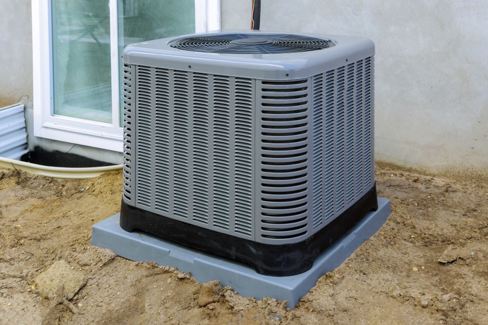 Air conditioning unit outside a home, highlighting importance of AC repairs for improved energy efficiency and indoor air quality in St. Clair County.