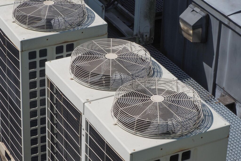 HVAC rooftop units with fans, illustrating air conditioning installation for efficient heating and cooling solutions.