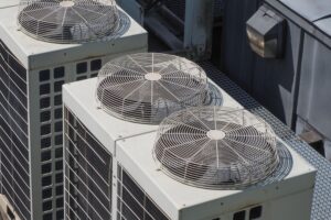 HVAC rooftop air conditioning units with visible fans, illustrating AC installation services relevant to S&P Heating LLC's offerings.