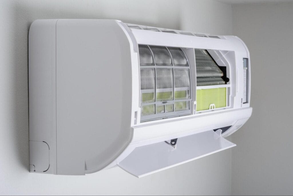 Open indoor heat pump unit showing air filters during a Macomb, MI heat pump installation