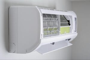 Open indoor heat pump unit showing air filters during a Macomb, MI heat pump installation