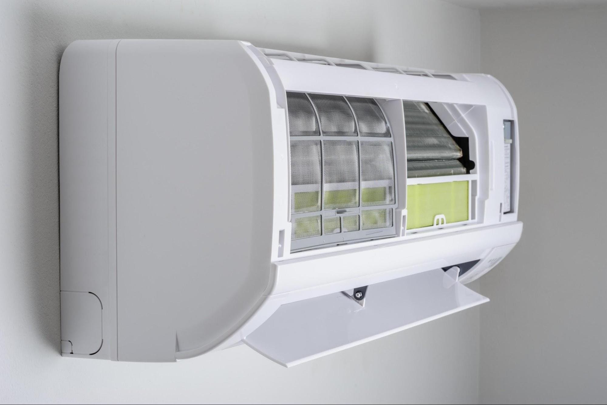 Open indoor heat pump unit showing air filters during a Macomb, MI heat pump installation