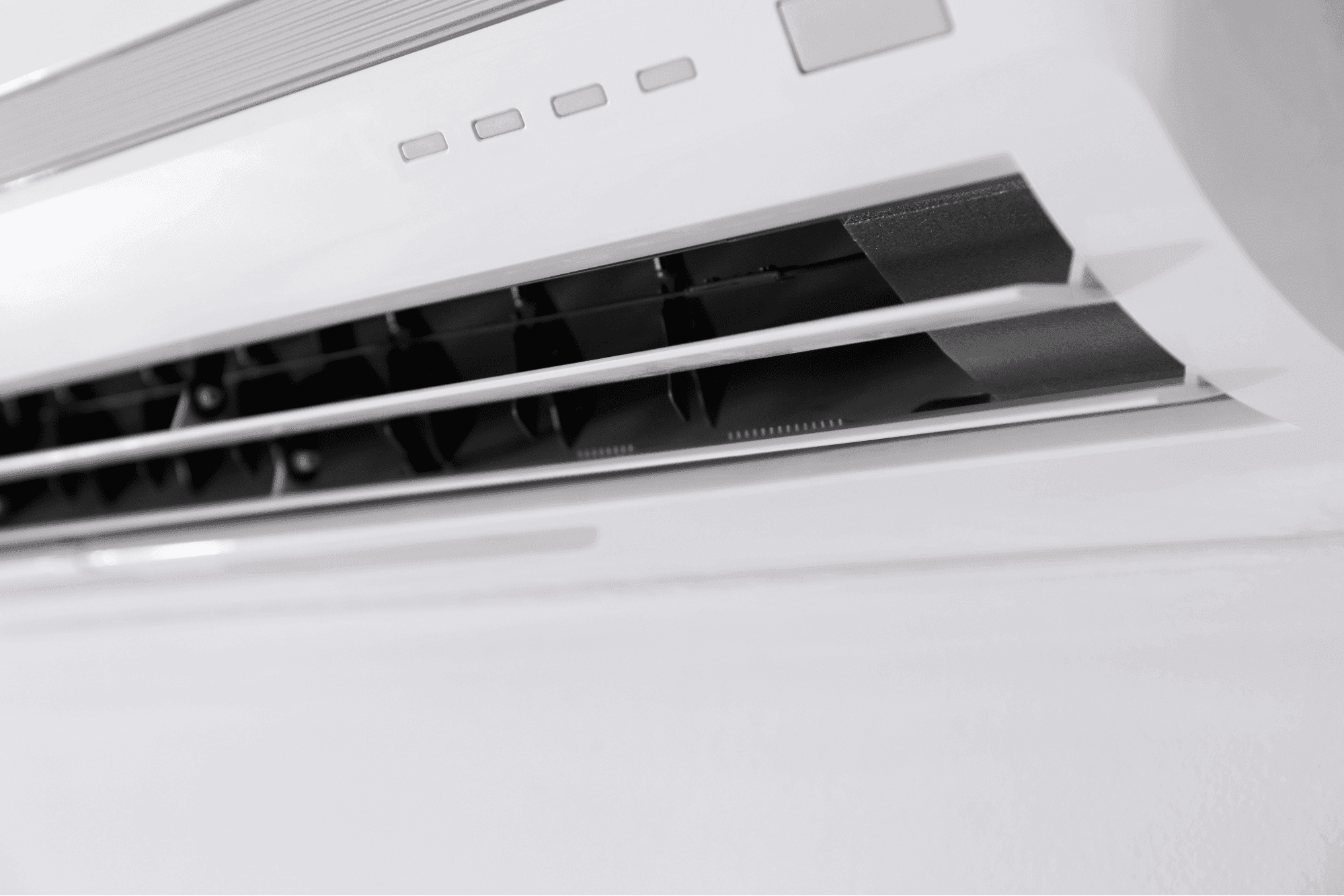 Close-up of heat pump vent louvers and control panel for efficient airflow