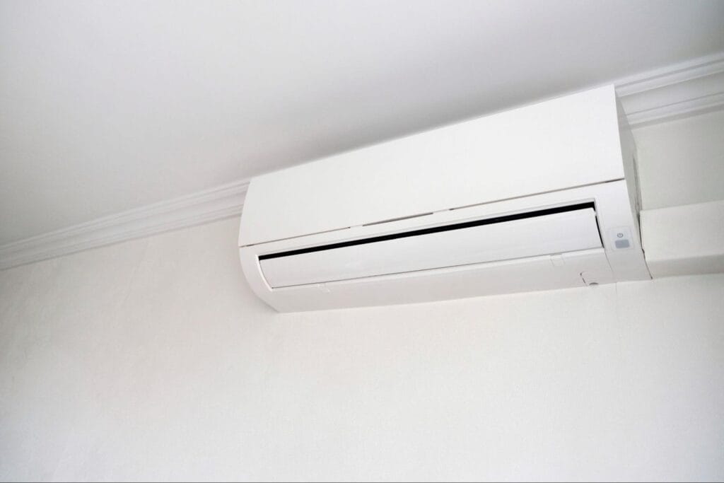 Close-up of a wall-mounted mini split indoor unit, the type of ductless system where filters should be inspected regularly during the cooling season