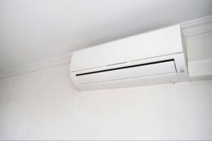 Close-up of a wall-mounted mini split indoor unit, the type of ductless system where filters should be inspected regularly during the cooling season