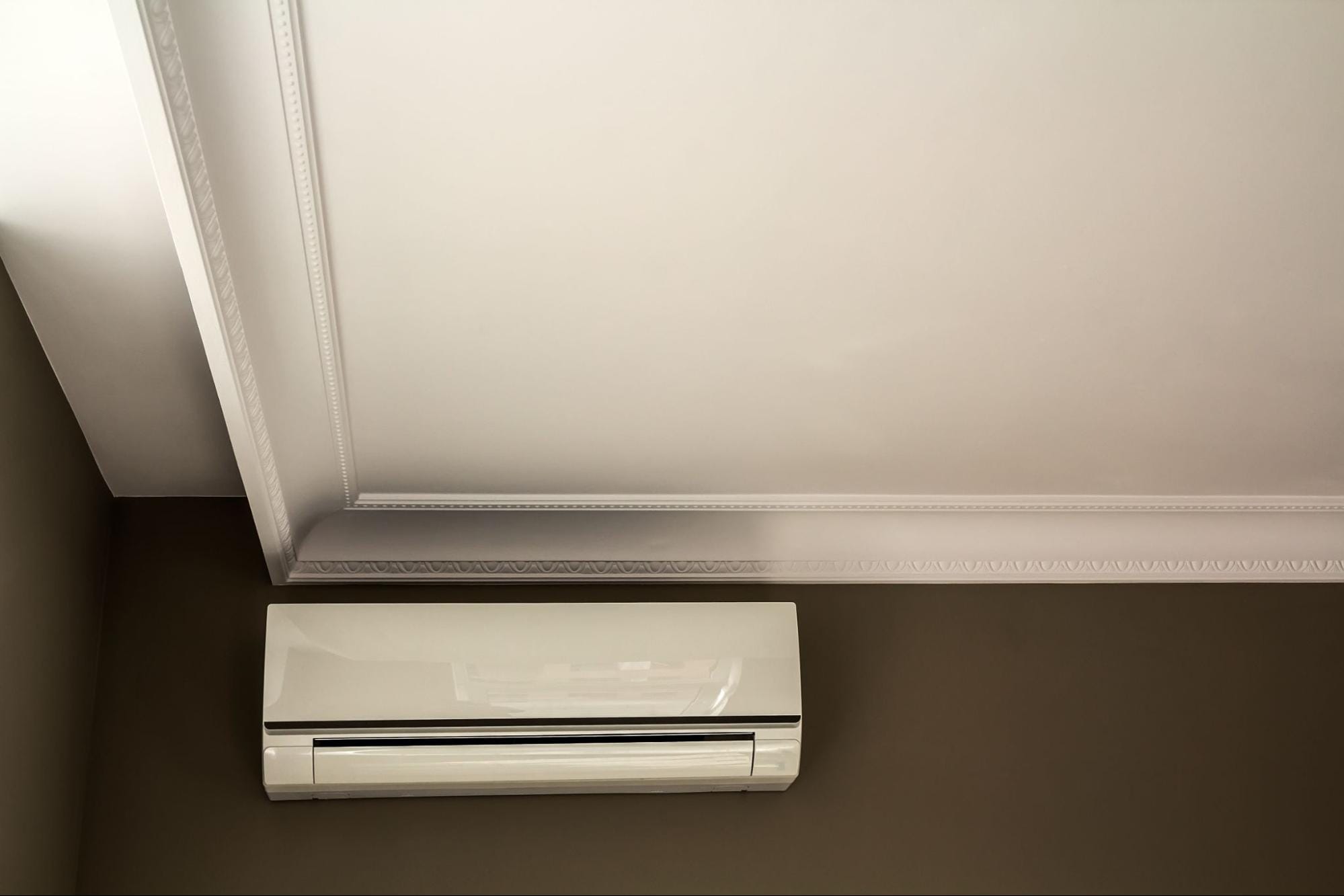 Close-up of a wall-mounted mini split indoor unit, the type of ductless system with washable filters that need regular cleaning during allergy season