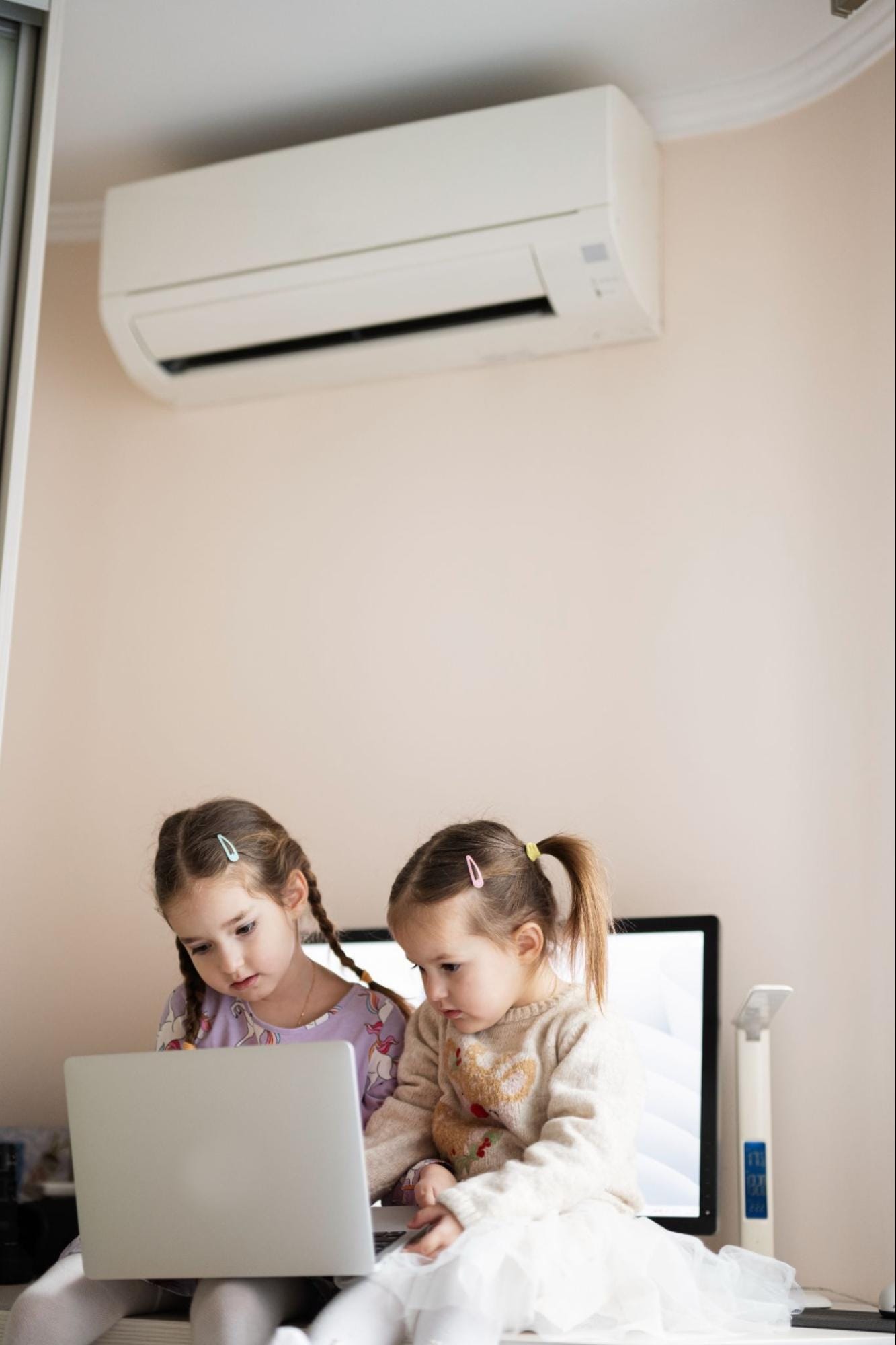 Mini split cooling a room where children are spending time indoors, the kind of extended summer use that places added demand on ductless systems