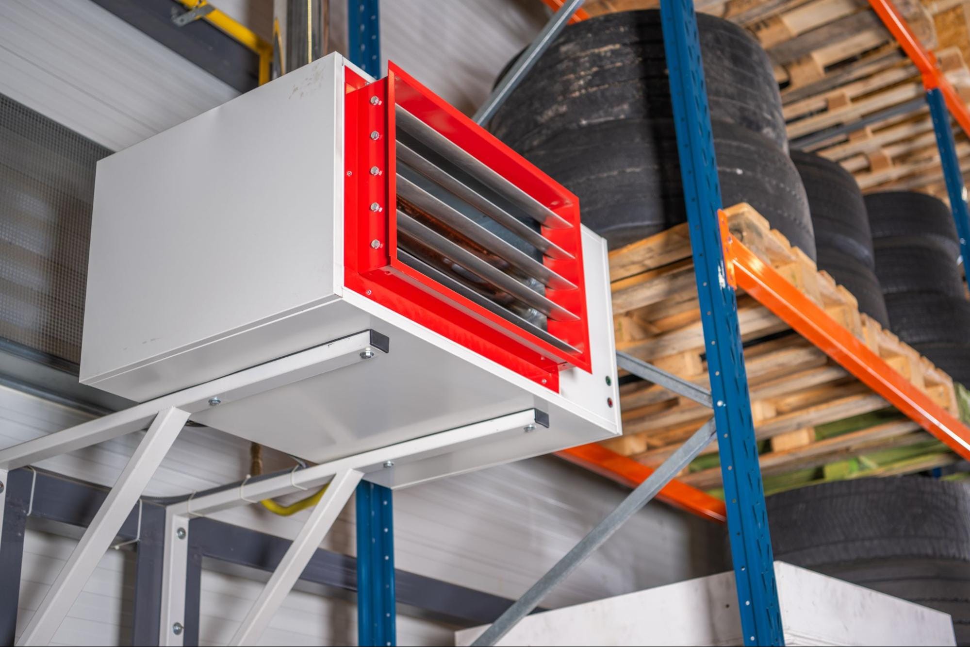 Suspended commercial unit heater installed in a warehouse ceiling in Clay Township, MI