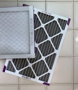 Two 14x20x1 pleated air filters with MERV 12 rating used for HVAC filter replacement in Clay Township, MI