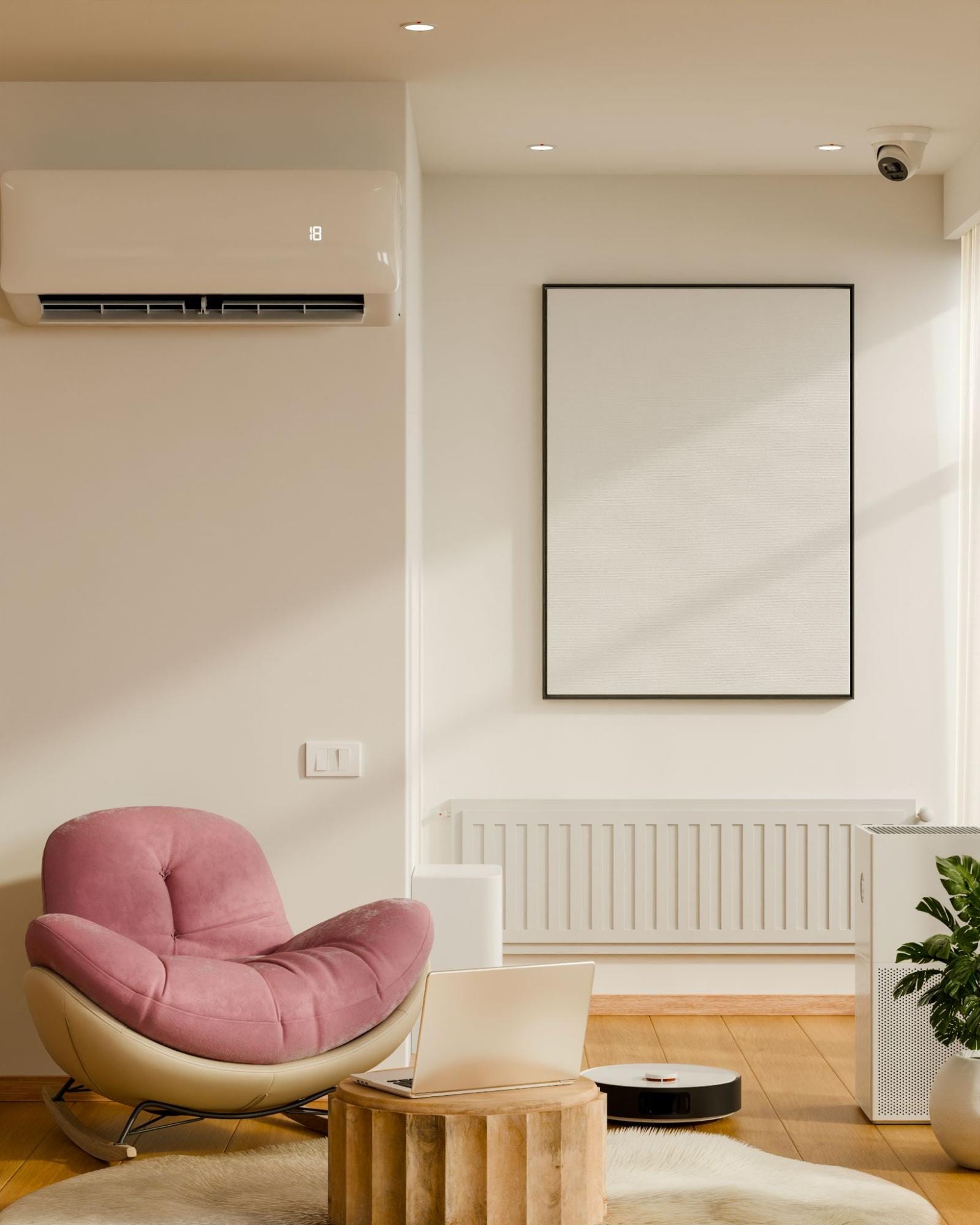 Modern living room with a wall-mounted ductless mini split cooling the space, shown above a pink rocking chair, a wooden side table with a laptop, a robot vacuum, and an air purifier, representing comfortable home climate control from S&P Heating in Clay Township, MI